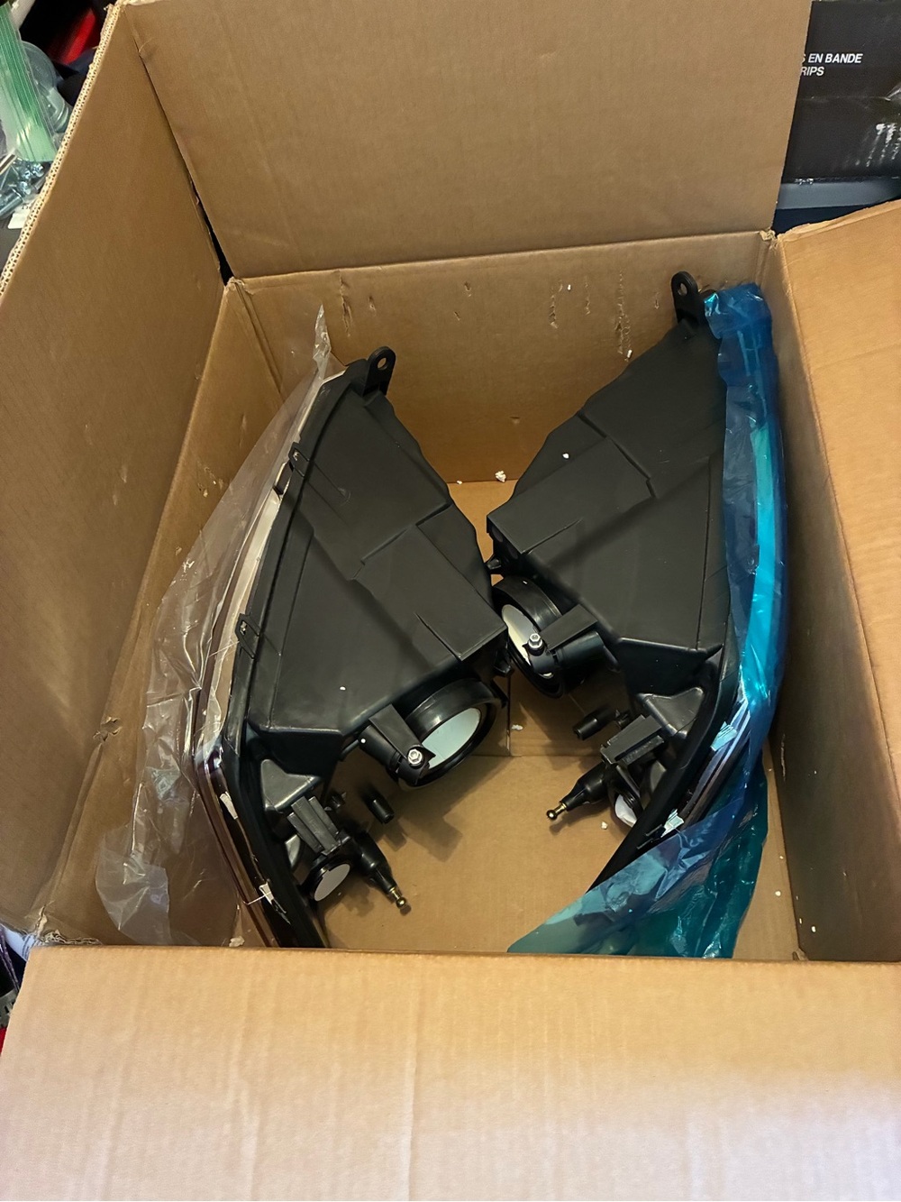 Pair of Black Automotive Headlight Assemblies